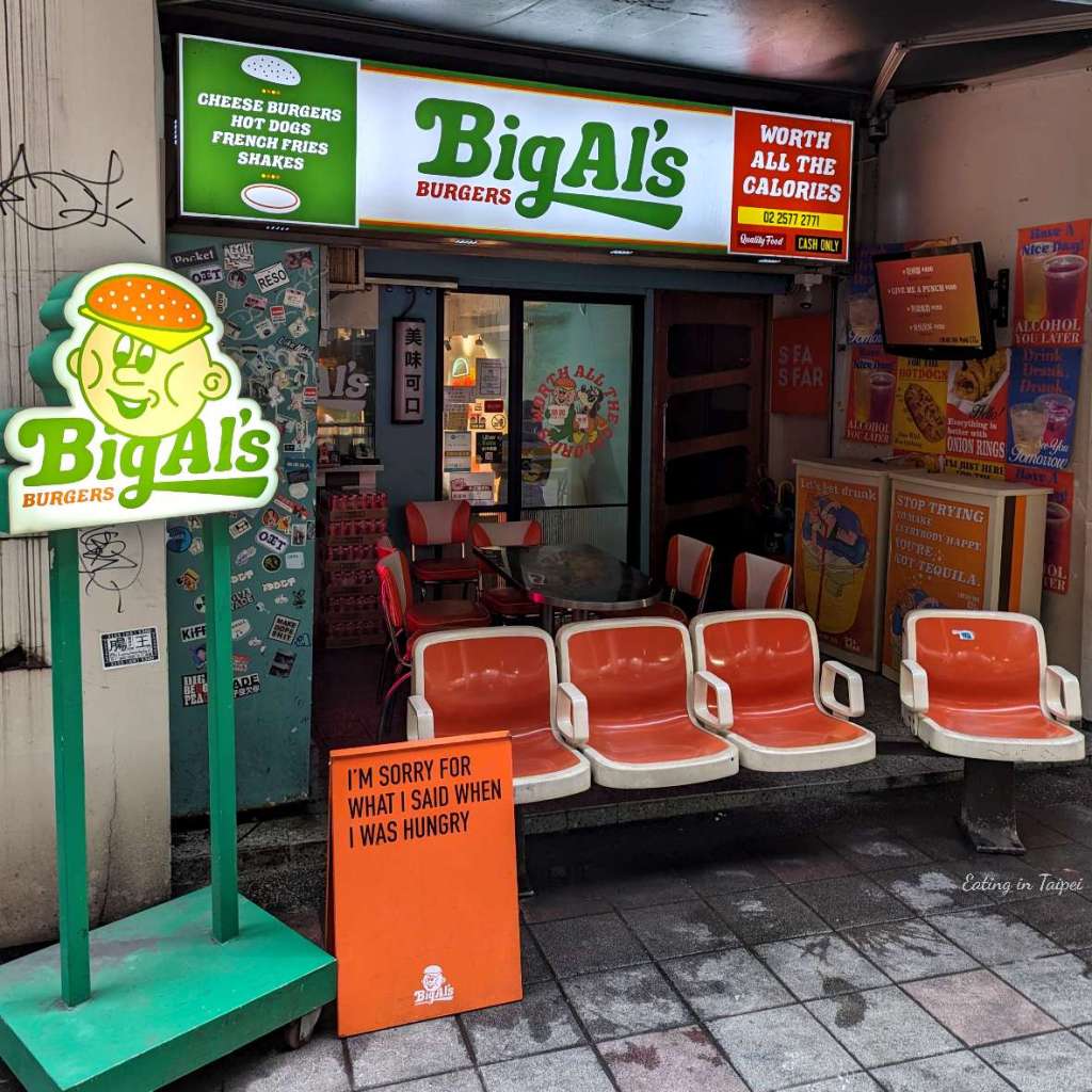 Big Al's Burgers from the outside is a cacophony of brightly lit LED signs. Of course, their branded logo man who I can only assume is Big Al himself, features heavily. He's a round faced chap with a burger patty hat. Playful, fun, and cute.